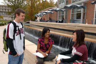 students at library fountain